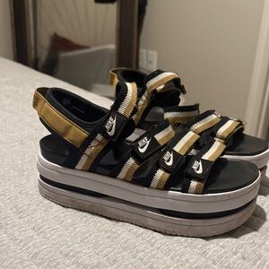 Nike Black and Gold Striped Platform Sandals